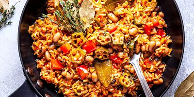 A pot of Jollof rice on a stove.